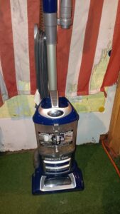 The low-profile floorhead underside of the Shark Navigator NV360 showing the fixed brushroll height with no physical adjustment levels.