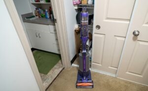 The 7.16-lb Shark PowerDetect IA3241 cordless vacuum docking onto its 14.2-lb full-system auto-empty base station.
