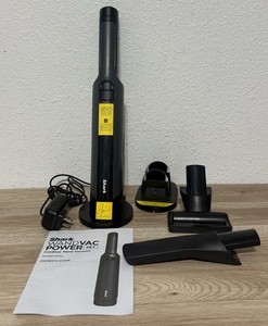 Using the ultra-lightweight 1.5-lb Shark WANDVAC POWER PET WV410 handheld vacuum to clean localized crumbs on a countertop.