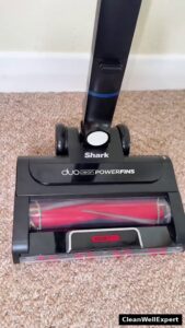Close-up top view of the Shark Stratos DuoClean PowerFins HairPro floor head showing the self-cleaning brushroll design
