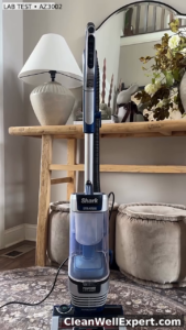 Fully assembled Shark Stratos Upright AZ3002 vacuum standing on a living room rug