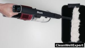 Top-down view of the Shark Vertex Pro IZ662H cordless vacuum testing fine dust pickup