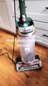Shark DuoClean Detect upright vacuum overview showing dust cup and floorhead