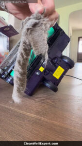 large clump of hair dust and debris removed from Shark PowerDetect vacuum floorhead after cleaning