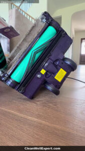 removing Shark DuoClean soft front roller with hair debris for separate cleaning without breaking plastic latch